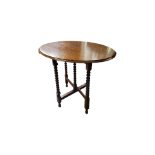 AN EARLY 20TH CENTURY OAK FOLDING OVAL OCCASIONAL TABLE On bobbin turned supports. (w 76cm x d