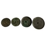 FOUR ASSORTED CIRCULAR ARCHAISTIC BRONZE CHINESE MIRRORS. (largest w 21.5cm)