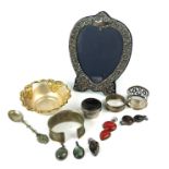 A COLLECTION OF 20TH CENTURY SILVER TRINKETS To include an easel photograph frame with embossed