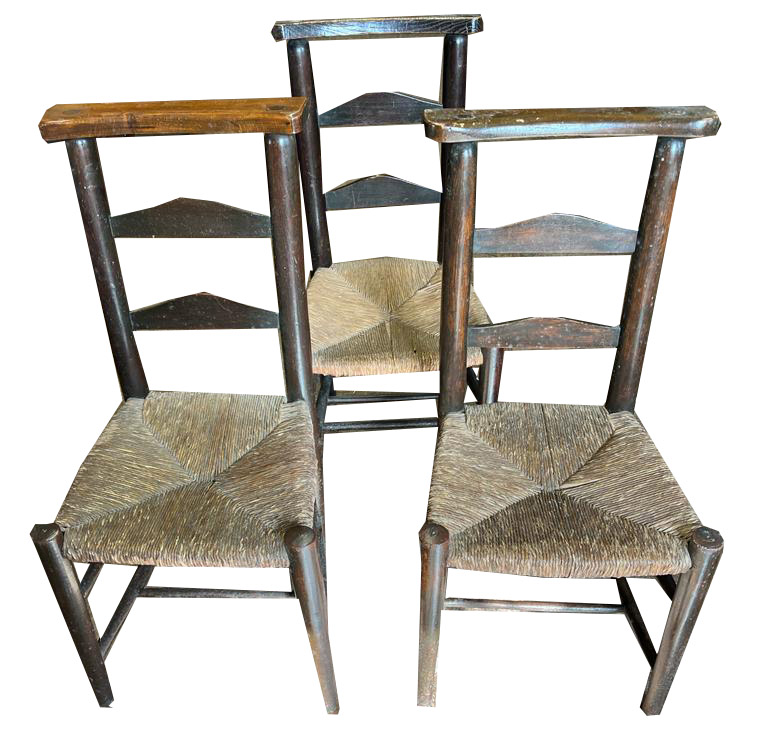 THREE 19TH CENTURY RUSH SEAT LADDER BACK CHURCH CHAIRS One stamped 'St. Pauls', the other bearing