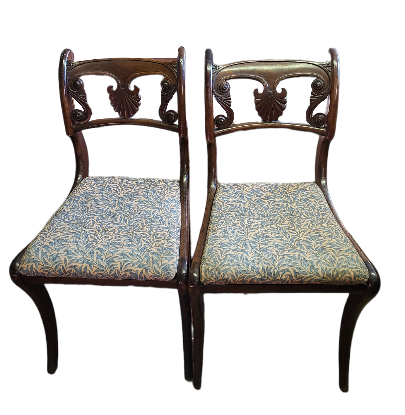 A PAIR OF REGENCY MAHOGANY STANDARD CHAIRS With pierced shell and scroll backs and upholstered