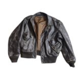 SCHOTT, A VINTAGE BROWN LEATHER JACKET Having stud clasp epaulets (approx Large). Condition: some