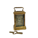 A MINIATURE SÈVRES STYLE FRENCH PORCELAIN AND POLISHED BRASS CARRIAGE CLOCK Having a glass top and