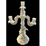 SITZENDORF, A LATE 19TH/EARLY 20TH CENTURY GERMAN BLANC DE CHINE THREE BRANCH FIGURAL CANDELABRA