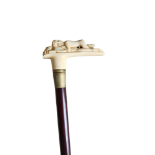 AN EROTIC CARVED POLISHED BONE HANDLED WALIKG STICK. (h 94cm) Condition: good
