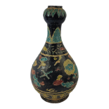 AN ANTIQUE CHINESE TERRACOTTA GARLIC NECK VASE With chinoiserie decoration on black ground. (h 37cm)
