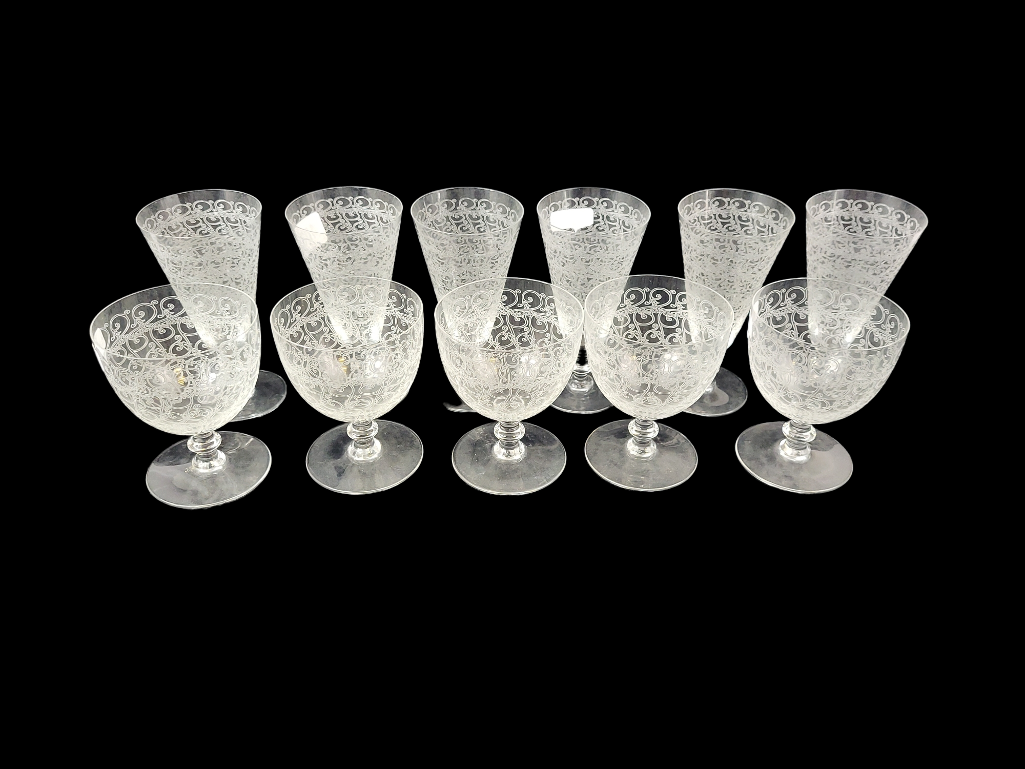 A SET OF SIX LATE 19TH/EARLY 20TH CENTURY FLUTED WINE GLASSES Engraved with scrolling foliage