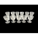 A SET OF SIX LATE 19TH/EARLY 20TH CENTURY FLUTED WINE GLASSES Engraved with scrolling foliage