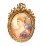 A 19TH CENTURY CONTINENTAL WATERCOLOUR ON IVORY, PORTRAIT OF A YOUNG WOMAN Signed 'Gounod Nice,
