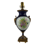 A FRENCH PORCELAIN TABLE LAMP With decorated panels on midnight blue ground. (h 46cm) Condition: