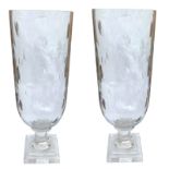 A PAIR OF CUT GLASS STORM LAMPS With engraved oval decoration. (h 34cm) Condition: good