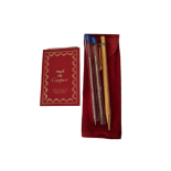 MUST DE CARTIER, A VINTAGE GOLD PLATED BALLPOINT PEN Having a reeded design to cast and white