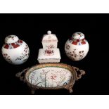 A CONTINENTAL BRONZE AND PORCELAIN FLORAL DISH Together with a pair of ginger jars, a tea caddy