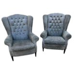 A PAIR OF GEORGIAN DESIGN WING ARMCHAIRS In button back green fabric upholstery, on square