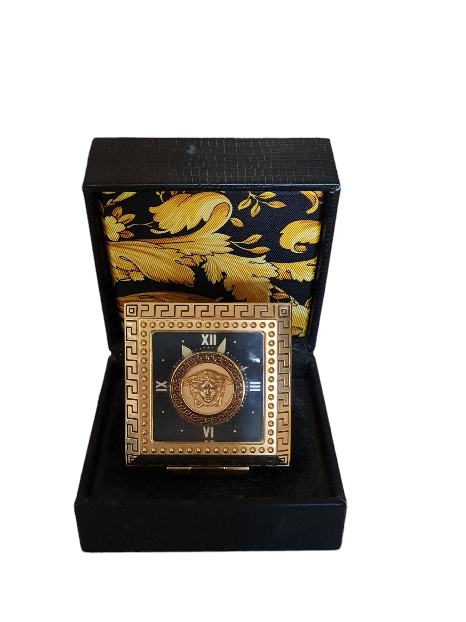 GIANNI VERSACE, A VINTAGE GILT METAL TRAVELING CLOCK In original padded case and outer box. (7cm x