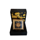 GIANNI VERSACE, A VINTAGE GILT METAL TRAVELING CLOCK In original padded case and outer box. (7cm x