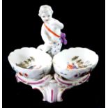 KPM, ROYAL BERLIN WORKS, A LATE 19TH CENTURY PAIR OF SALTS FORMED AS CHERUBS Interiors painted