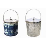 TWO BLUE AND WHITE CERAMIC BISCUIT BARRELS With silver plate lid and handle, decorated with London