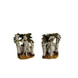 A PAIR OF EARLY 20TH CENTURY FRENCH BISQUE VASE/BOOKENDS In the form of a lady and gentleman in