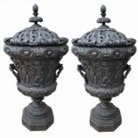 A PAIR OF LARGE HEAVILY CARVED AND DECORATED CLASSICAL STYLE CAMPAGNA WOODEN URNS AND LIDS On