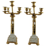 A PAIR OF CRYSTAL AND GILT BRONZE MOUNTED FIVE BRANCH CANDELABRAS Grecian design columns on pedestal