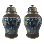 A PAIR OF LARGE CHINESE CRACKLE GLAZED BLUE & WHITE TEMPLE JARS Decorated with court scenes, brown