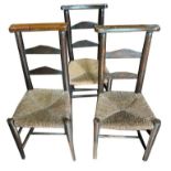 THREE 19TH CENTURY RUSH SEAT LADDER BACK CHURCH CHAIRS One stamped 'St. Pauls', the other bearing