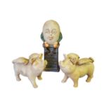 THREE CAST IRON NOVELTY MONEY BOXES Humpty Dumpty and two winged pigs. (tallest 14cm) Condition: