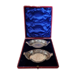 A PAIR OF LATE VICTORIAN CASED HALLMARKED SILVER SWEETMEAT BASKETS With pierced cartouche bodies and