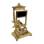 A GILT BRONZE TABLE TOP VANITY MIRROR With a cherub crest. (h 24cm) Condition: good