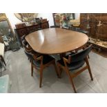 A 20TH CENTURY DANISH DYRLUND TEAK EXTENDING DINING TABLE Complete with two extra leaves and eight