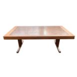 A STYLISH MID 20TH CENTURY DANISH TEAK AND COPPER EMBOSSED COFFEE TABLE.