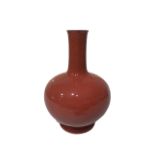 A CHINESE GLOBULAR OXTAIL BLOOD COLOURED VASE With elongated neck, bearing six character seal mark