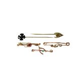 A COLLECTION OF 9CT GOLD BAR BROOCHES AND STICK PINS To include stylised wishbone examples. (gross