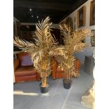 A PAIR OF ARTIFICIAL GOLD PAINTED PLANTS.