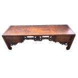 A 19TH CENTURY CHINESE HONGMOU KANG LOW TABLE, the single panel top set within a rectangular frame