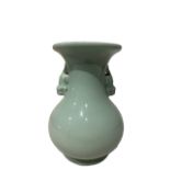 A TWIN HANDLED CHINESE CELADON YUHUCHUNPING SHAPED VASE Bearing a six character mark and