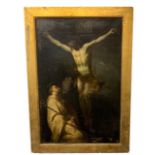 A 17TH CENTURY ITALIAN OIL ON CANVAS, CHRIST ON THE CROSS WITH ST. FRANCIS OF ASSISSI KNEELING