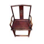 A 19TH CENTURY CHINESE ELM CHAIR with carved panel back above a panel seat raised on four legs