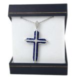 AN 18CT WHITE GOLD, SAPPHIRE AND DIAMOND CROSS. (Sapphires 5.35ct, Diamonds 0.63ct)