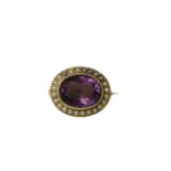 MURRLE BENNETT & CO., A VICTORIAN 15CT GOLD, LARGE OVAL CUT AMETHYST AND SEED PEARL BROOCH