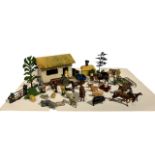 A COLLECTION OF BRITAINS FARM SERIES LEAD FIGURINES AND SCENERY.