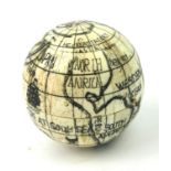 A POLISHED BONE GLOBE COMPASS. (diameter 7.5cm) Condition: good overall