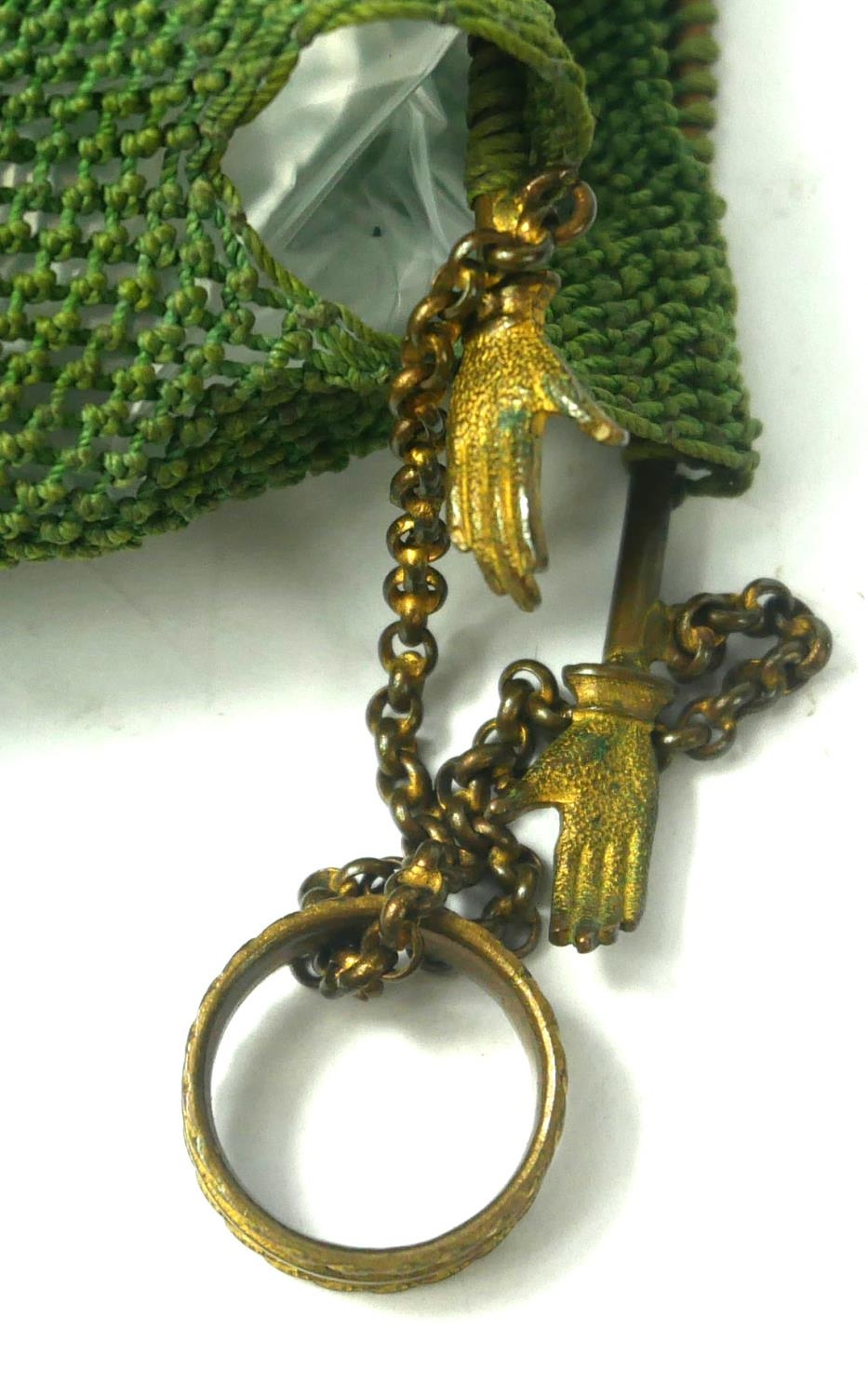 A 19TH CENTURY GILT METAL MISER'S PURSE Set with two pairs of hands and ring seal on green fabric - Image 6 of 6