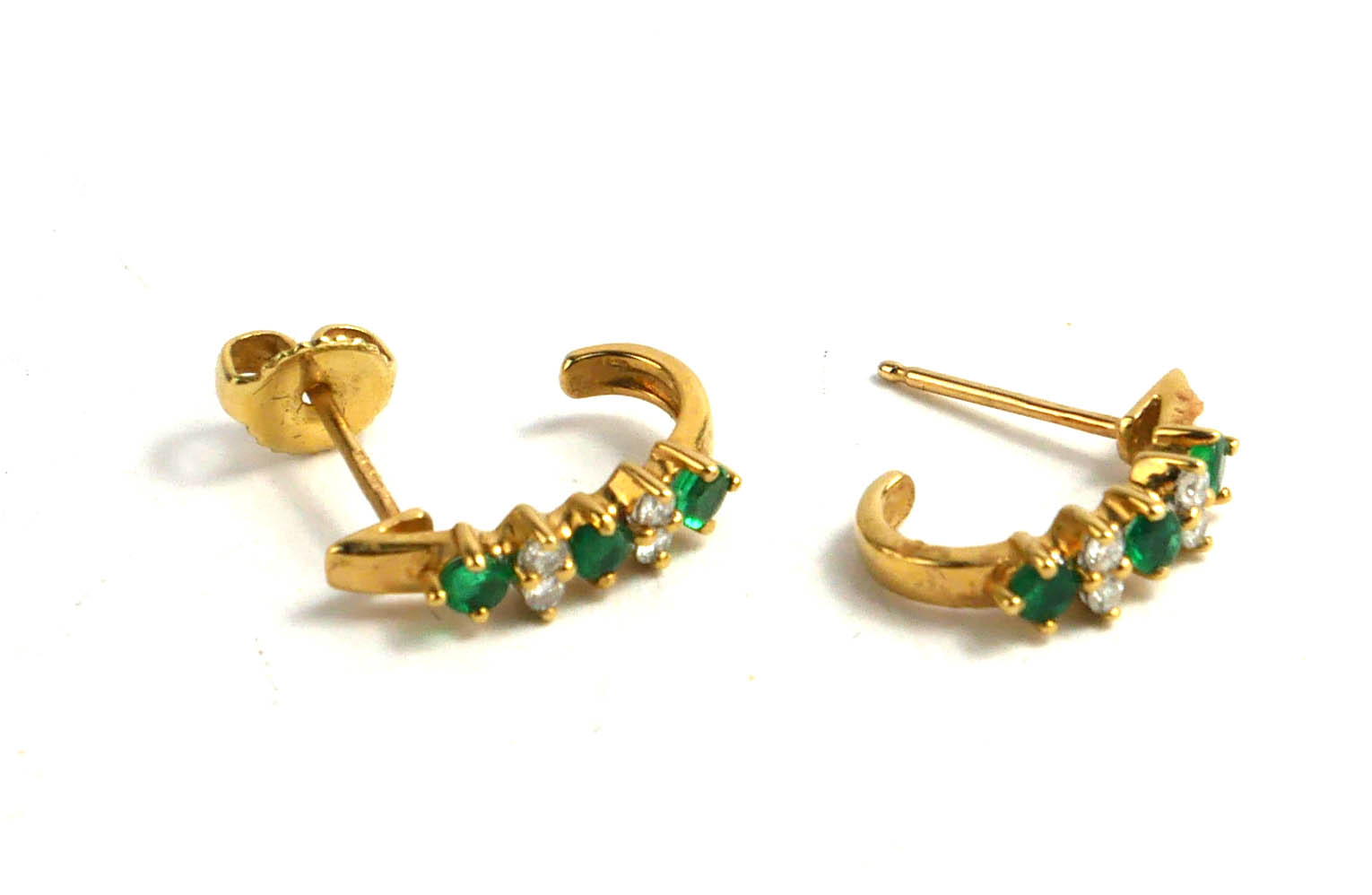 A PAIR OF 18CT GOLD EMERALD AND DIAMOND EARRINGS Each having two pairs of round cut diamonds