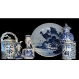 A COLLECTION OF BLUE AND WHITE DECORATED ORIENTAL ITEMS To include vases, teapots and charger. (