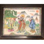 A CHINESE PORCELAIN PLAQUE Decorated with figures in a garden setting and script, framed. (33cm x