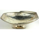 A LATE 19TH CENTURY SILVER CAKE BASKET The swing handle decorated with pierced and engraved