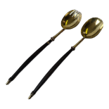 A PAIR OF VICTORIAN SILVER GILT SALAD SERVERS Having carved handles and gold plated finish,