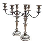 A PAIR OF EARLY 20TH CENTURY SILVER PLATED CANDELABRA Having three sconces with gadrooned border and